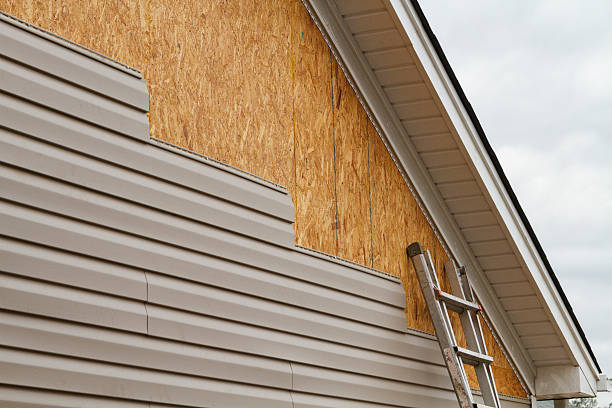 Professional Storm Damage Siding Repair technician working in Aurora, OH